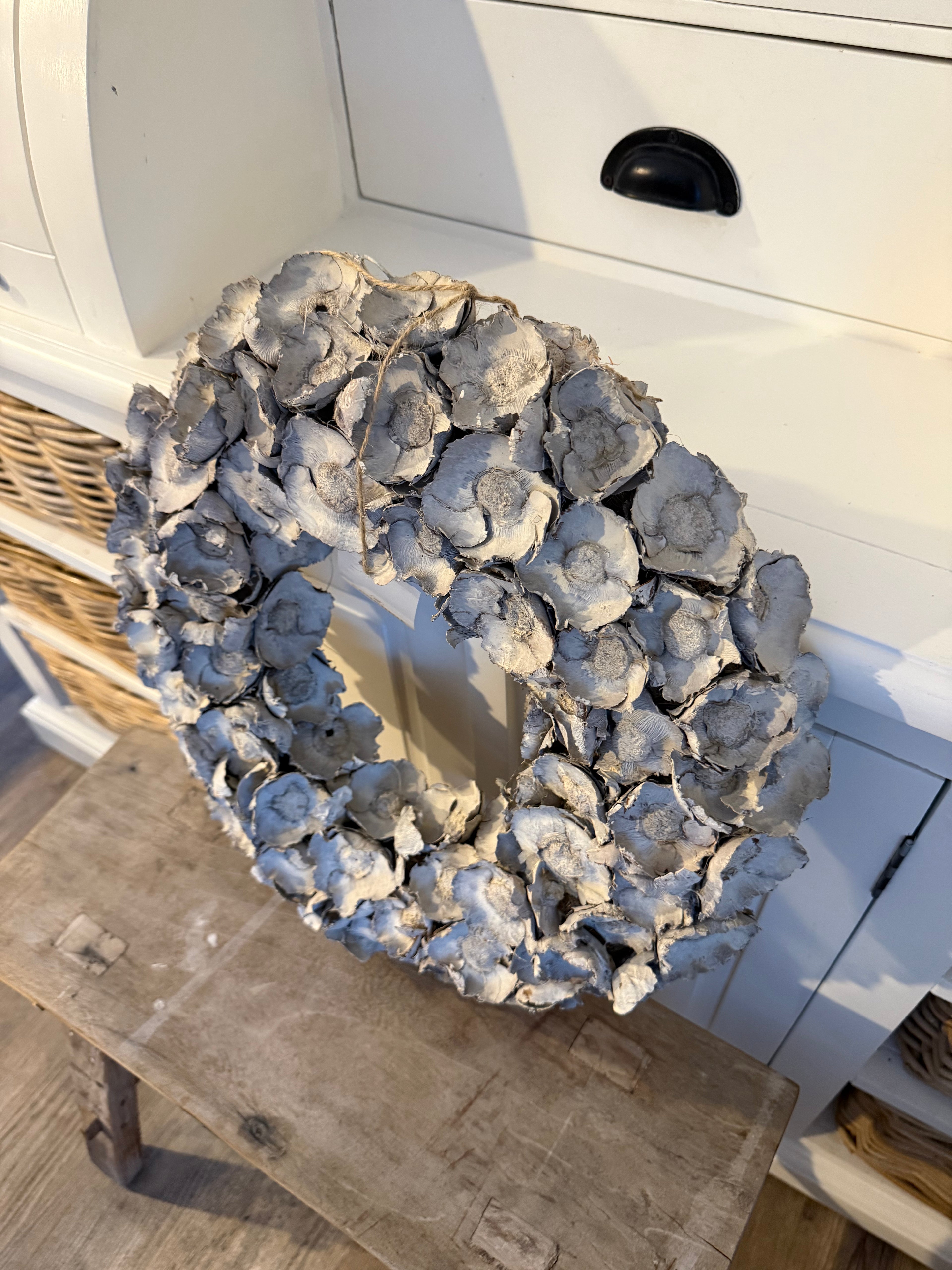 Kranz aus Kokosblumen Sandstone